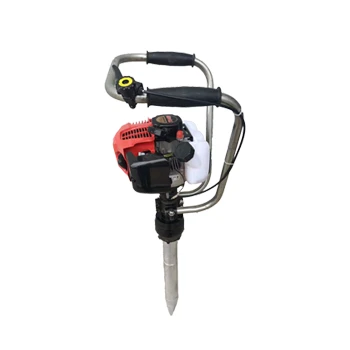 hand held rail tamper in operation
